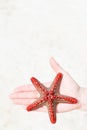 Starfish on woman`s palm Royalty Free Stock Photo