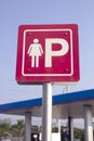 Woman`s parking sign in a blue gas station Royalty Free Stock Photo