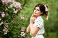 Close-up portrait of young beautiful Russian brunette girl at summer green park Royalty Free Stock Photo