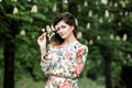 Close-up portrait of young beautiful Russian brunette girl at summer green park Royalty Free Stock Photo