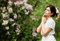 Close-up portrait of young beautiful Russian brunette girl at summer green park Royalty Free Stock Photo