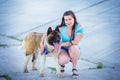 The woman`s portrait on walk with the pet - a dog of breed the Akita Royalty Free Stock Photo