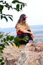 woman's profile, looking at the green landscape.