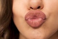 Woman`s pursed lips