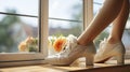 A Woman\'s Shoes Poised Gracefully on a Sunlit Window Sill. Generative AI