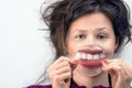 Woman's smile through the magnifying glass