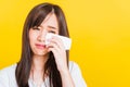 Woman sad she crying wiping tears from eyes with a tissue Royalty Free Stock Photo