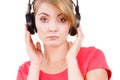 Woman sad girl in big headphones listening music Royalty Free Stock Photo