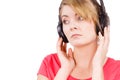 Woman sad girl in big headphones listening music Royalty Free Stock Photo