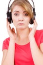 Woman sad girl in big headphones listening music Royalty Free Stock Photo