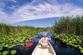 Woman sailing in Danube Delta with a boat Royalty Free Stock Photo