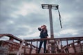 A woman sailor on a pirate ship looks into the distance in search of land