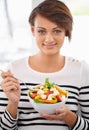 Woman, salad and healthy food in portrait for diet with detox, breakfast and lunch at home. Young person eating Royalty Free Stock Photo