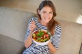 Woman, salad and smile with portrait, diet and health or wellness for weight loss. Lady, living room and organic Royalty Free Stock Photo