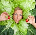 Woman with salal leafes around her head.