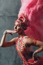 Woman in samba or lambada costume with pink feathers plumage Royalty Free Stock Photo