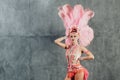 Woman in samba or lambada costume with pink feathers plumage Royalty Free Stock Photo