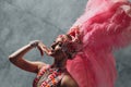 Woman in samba or lambada costume with pink feathers plumage Royalty Free Stock Photo