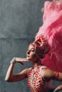 Woman in samba or lambada costume with pink feathers plumage Royalty Free Stock Photo