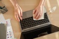 Woman Sanitizing Laptop at Workplace Above View