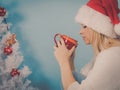 Woman in santa christmas hat drinking tea or coffee Royalty Free Stock Photo