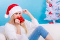 Woman in santa christmas hat drinking tea or coffee Royalty Free Stock Photo