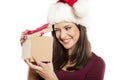 Woman with Santa Claus hat and a gift Royalty Free Stock Photo