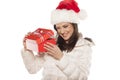 Woman with Santa Claus hat and a gift Royalty Free Stock Photo