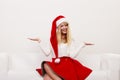 Woman in santa hat with empty hands for copy space Royalty Free Stock Photo