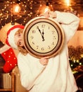 Woman Santa hat hold vintage clock. Time to celebrate. New year countdown. Unexpectedly soon. Midnight concept. Make