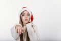 Woman in Santa hat pointing at camera by her finger Royalty Free Stock Photo