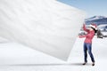 Woman with Santa hat pulls empty banner