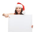 Woman in santa helper hat with blank white board Royalty Free Stock Photo