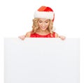 Woman in santa helper hat with blank white board Royalty Free Stock Photo