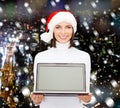 Woman in santa helper hat with laptop computer Royalty Free Stock Photo