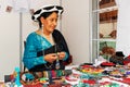 A woman of Saraguro ethnic group sells bead jewelery Royalty Free Stock Photo