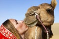 Woman in sari riding a camel. Royalty Free Stock Photo