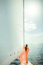 Woman in sarong yachting white sails luxury travel Royalty Free Stock Photo