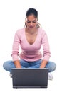 Woman sat using a laptop