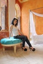 Woman sating on the blue chair Royalty Free Stock Photo