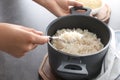 Woman with saucepan full of tasty rice Royalty Free Stock Photo