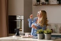 Woman savoring a moment with yogurt in kitchen