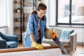 woman with saw sawing wooden board at home Royalty Free Stock Photo