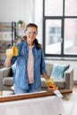 woman with saw sawing wooden board at home Royalty Free Stock Photo