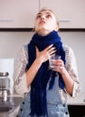 Woman in scarf gargling throat with domestic soda Royalty Free Stock Photo