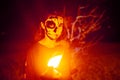 Woman with scary face paint make up during Halloween party at the artificial cemetery on the beach