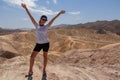 Death Valley - Woman with scenic view Badlands of Zabriskie Point, Furnace creek, Death Valley National Park, California