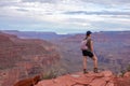 Grand Canyon - Woman with panoramic aerial view from Ooh Ahh point on South Kaibab hiking trail at South Rim, Arizona, USA Royalty Free Stock Photo