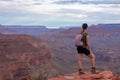 Grand Canyon - Woman with panoramic aerial view from Ooh Ahh point on South Kaibab hiking trail at South Rim, Arizona, USA