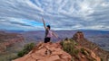 Grand Canyon - Woman with panoramic aerial view from Ooh Ahh point on South Kaibab hiking trail at South Rim, Arizona, USA